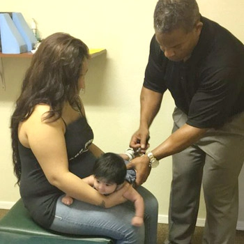 Chiropractor Casa Grande AZ Sean Jenkins With Mother And Baby